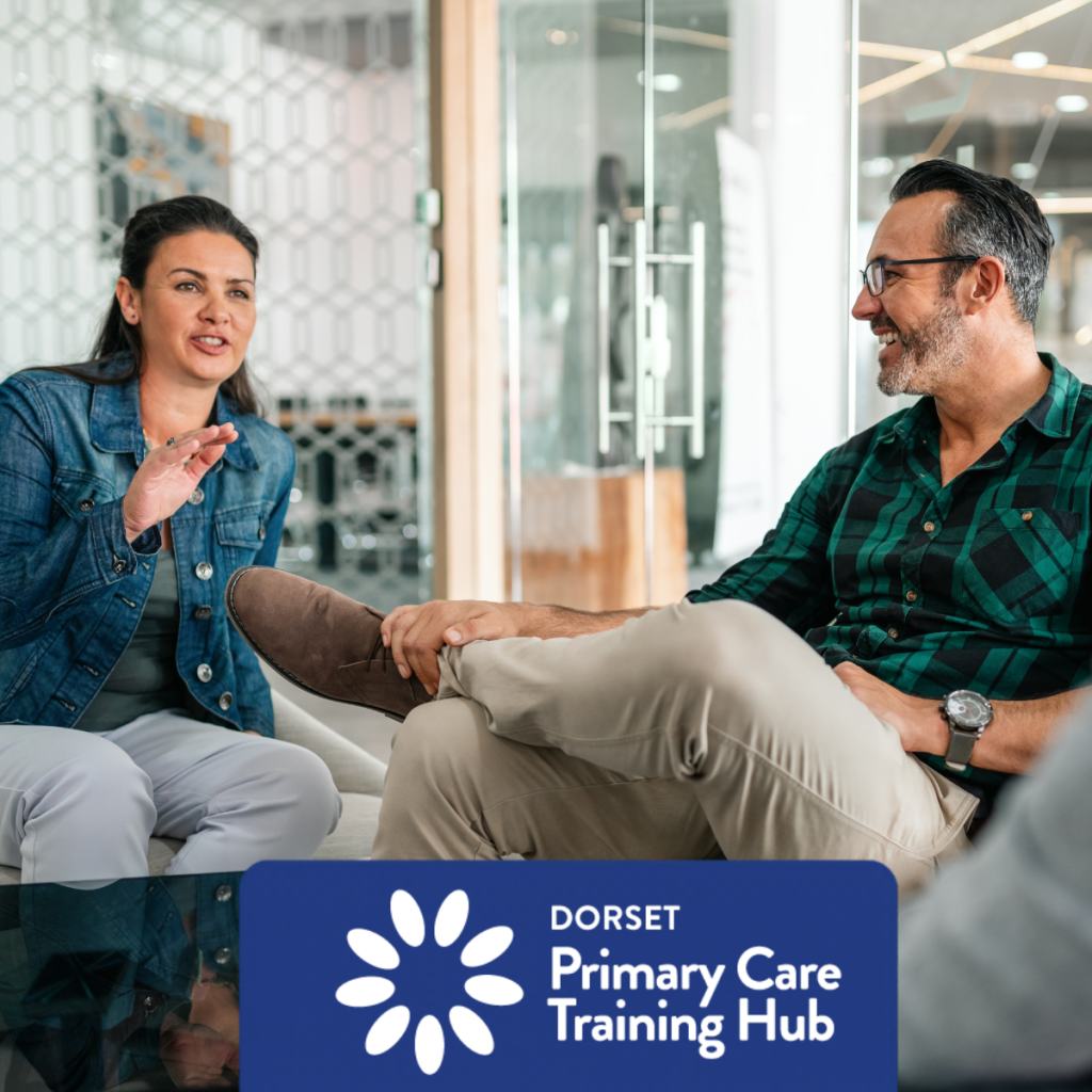 Two people sitting in a modern meeting space, smiling and talking during a coaching or mentoring session. The Dorset Primary Care Training Hub logo appears at the bottom of the image.